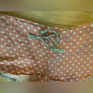 Vs womans L sleeping shots. Pink and white polkadots outside this inside and the